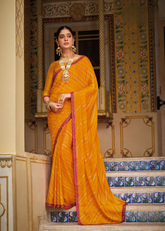 Mustard Yellow Printed Georgette Saree with Pink Border